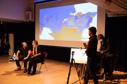 Roel Fox, Sarah Davies and Boyd Branch in AI painting – Artificial Intelligence Improvisation by Improbotics at the Attenborough Arts Centre, Leicester Comedy Festival 2022 – Photo by Stuart Hollis